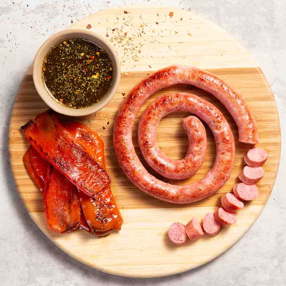 Receita de Linguiça calabresa fina na brasa com pimentão tostado e chimichurri